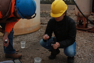 Students from Kansas State University sample water from natural gas production wells in the Cherokee basin of southern Kansas as part of a study to understand the role of microorganisms in the generation of natural gas from organic matter in the subsurface