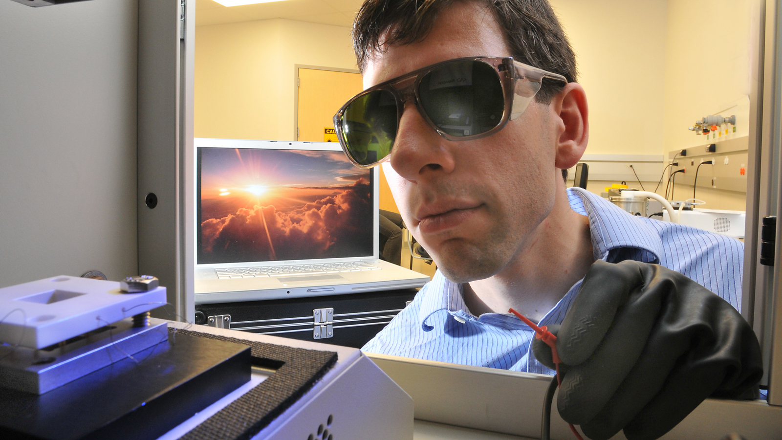 Argonne nanoscientist Seth Darling measures the performance of a nanostructured organic photovoltaic cell using a solar simulator that replicates sunlight under standardized conditions.