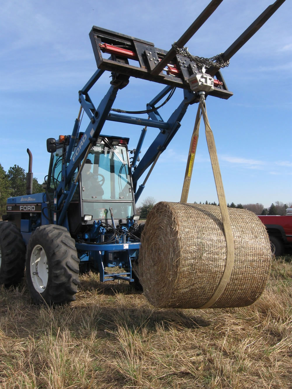 A bale of switchgrass is weighed after harvesting.