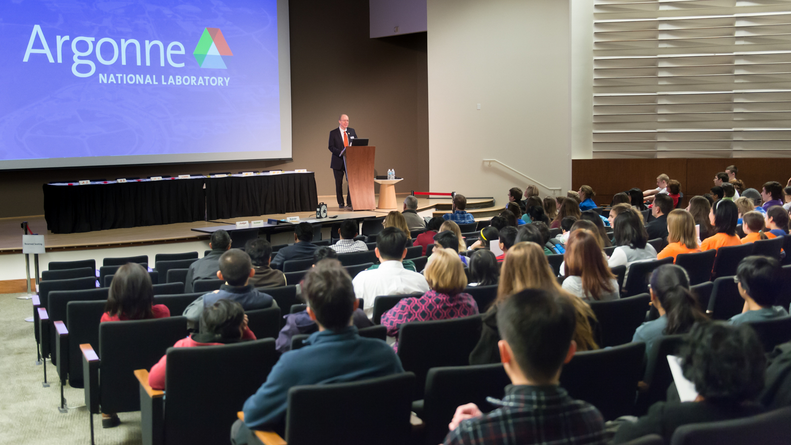 Bill Foster, congressman and former physicist, gives opening remarks to an auditorium of students, coaches and parents before the 2016 Argonne Regional Science Bowl.