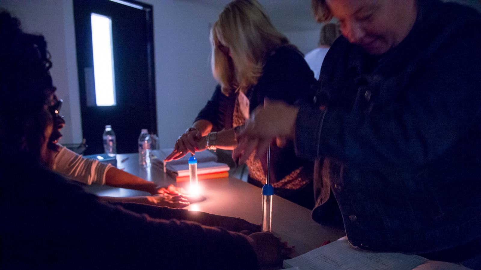 Science teachers at Argonne explore the science of pressure and combustion using fire syringes to simulate pistons in combustion engines. Photo credit: Mark Lopez, Argonne National Laboratory.