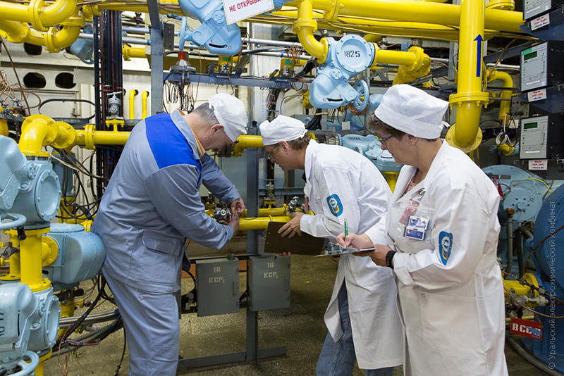 Monitors Julie Bremser, Jose March-Leuba, and Russian counterpart Aleksander Tikhonov check the tamper-indicating devices on the highly enriched uranium hexafluoride gas piping at the Ural Electrochemical Integrated Plant in Russia.