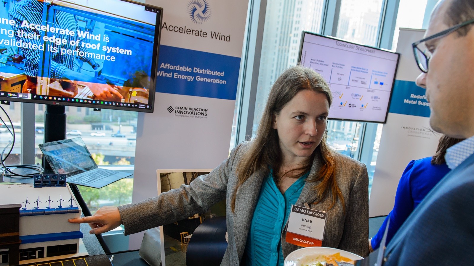 Erika Boeing, CEO of Accelerate Wind, shows her distributed wind rooftop-based generation platform at Demo Day. (Image by Argonne National Laboratory.)