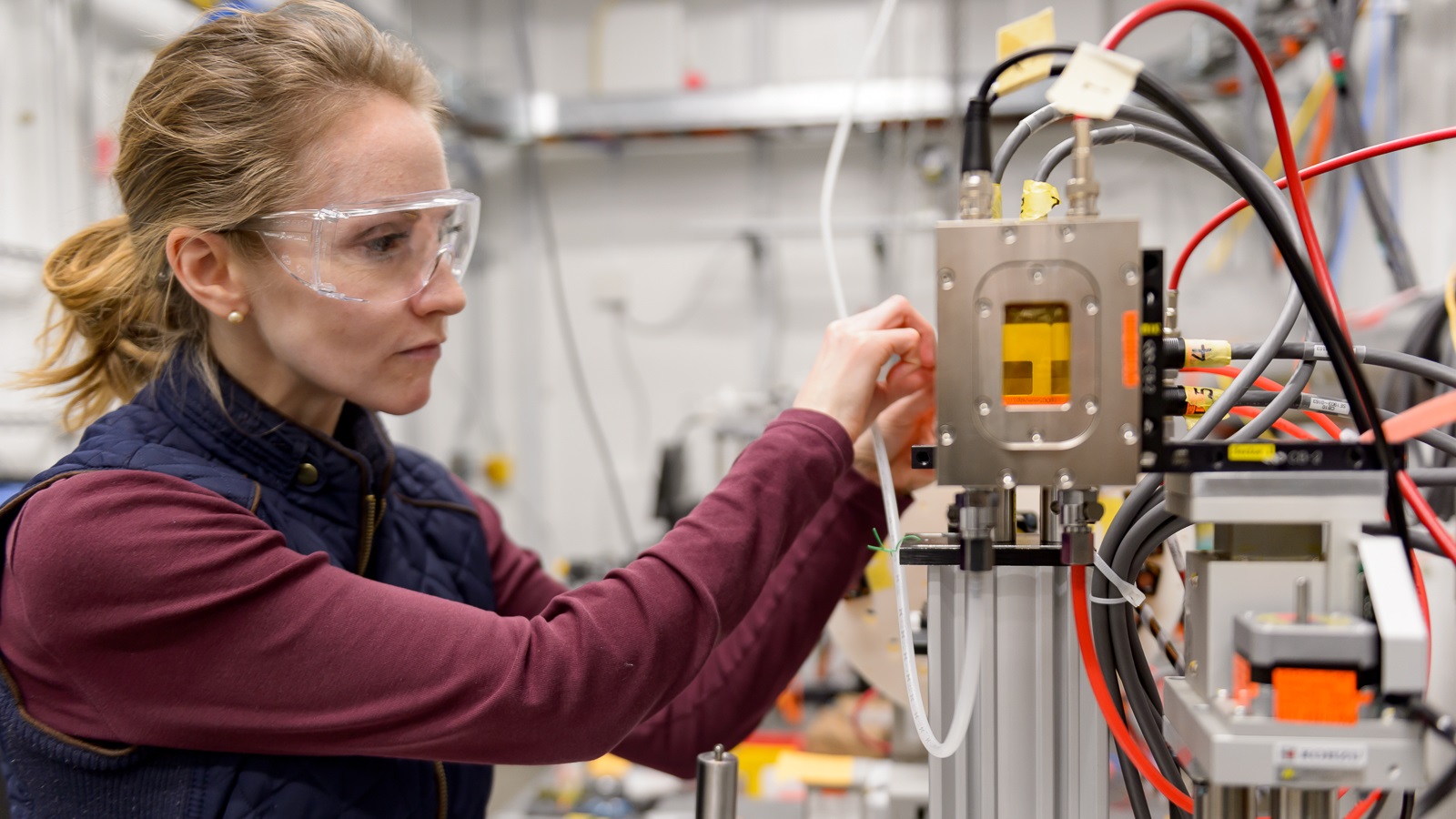 Ashley Spear of the University of Utah adjusts a beam-defining slit on the new high-throughput instrument installed at the 6-ID-D end-station of the Advanced Photon Source. 