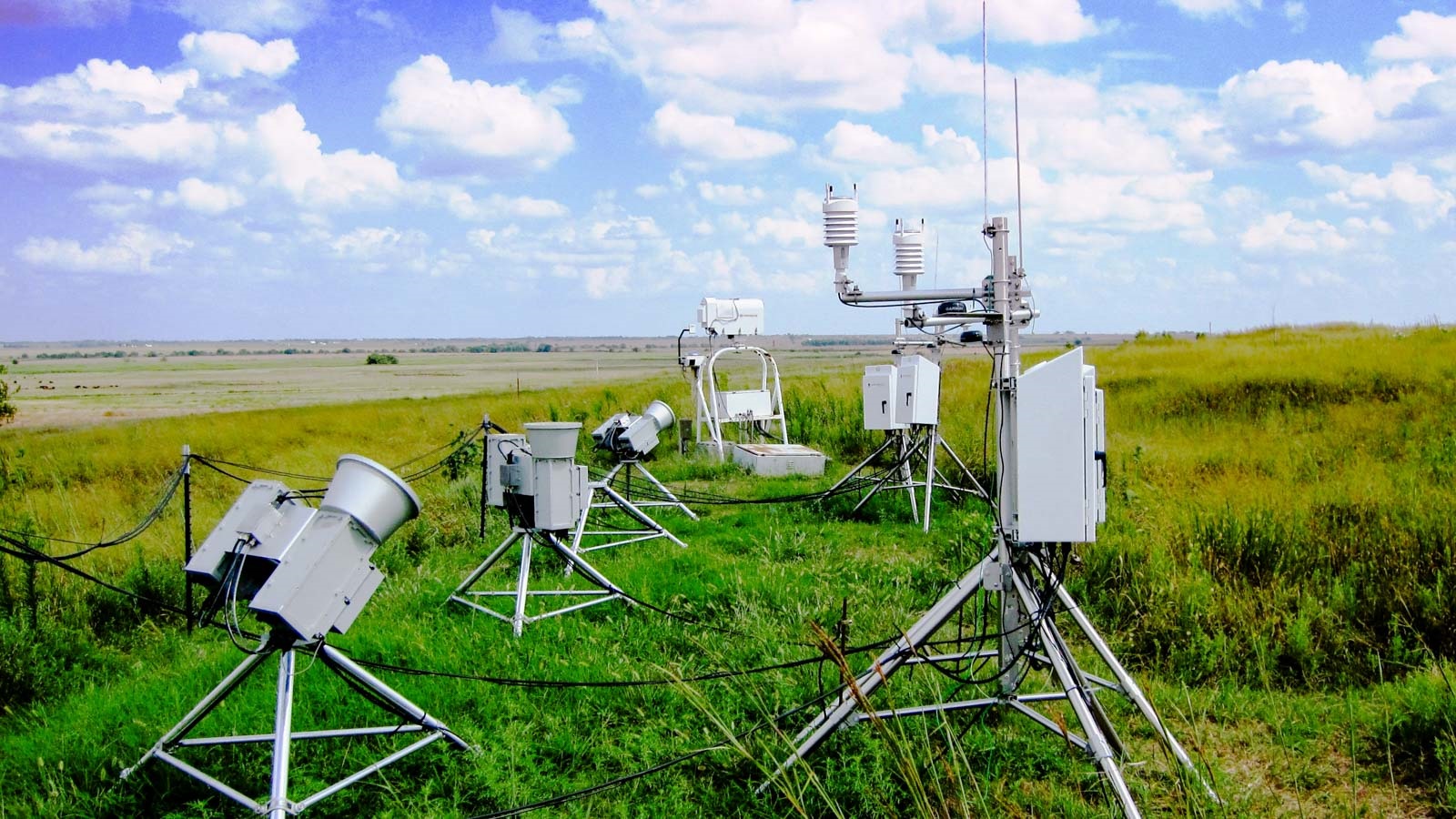 Equipment in a field. (Image by U.S. Department of Energy Atmospheric Radiation Measurement (ARM) user facility.)