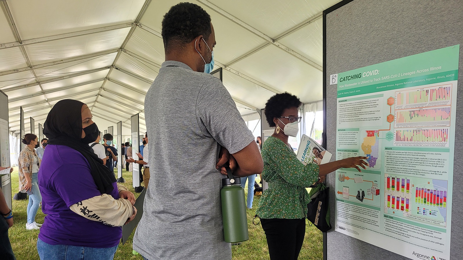 AAE participants check out some of the research presentations that this summer’s interns showcased at Learning on the Lawn.