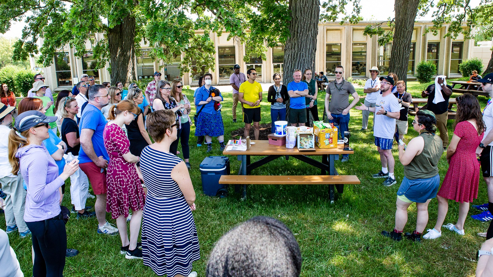 Gathering at a picnic table under trees. (Image by Argonne National Laboratory.)