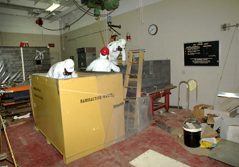 Decommissioning technicians package graphite from the original Chicago Pile-1 (CP-1) reactor that was being stored at ATSR.