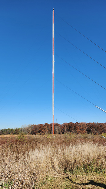 Photo of a meteorological tower in a field