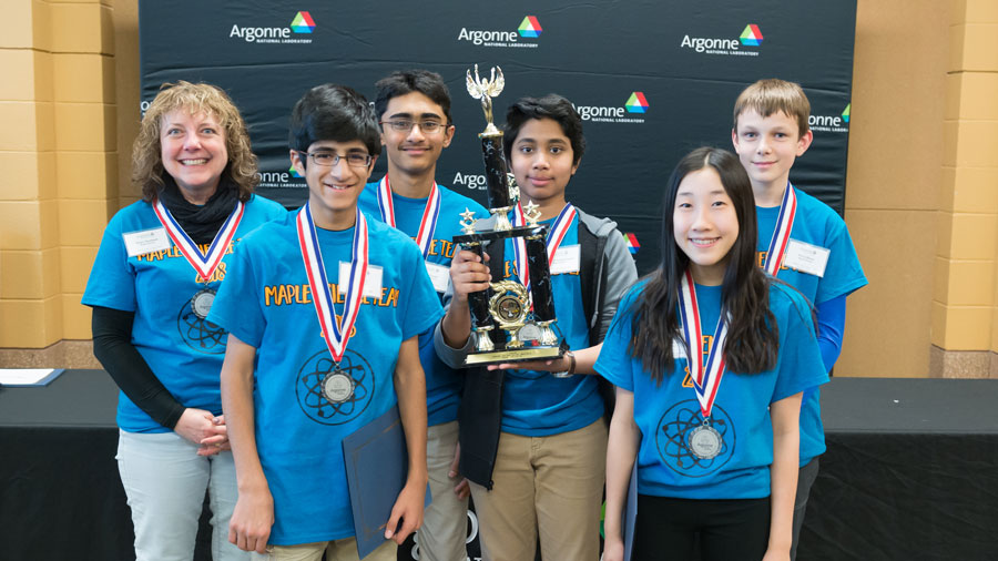 Students from Maple School pose with medals and a trophy for coming in second place at the Regional Middle School Science Bowl 