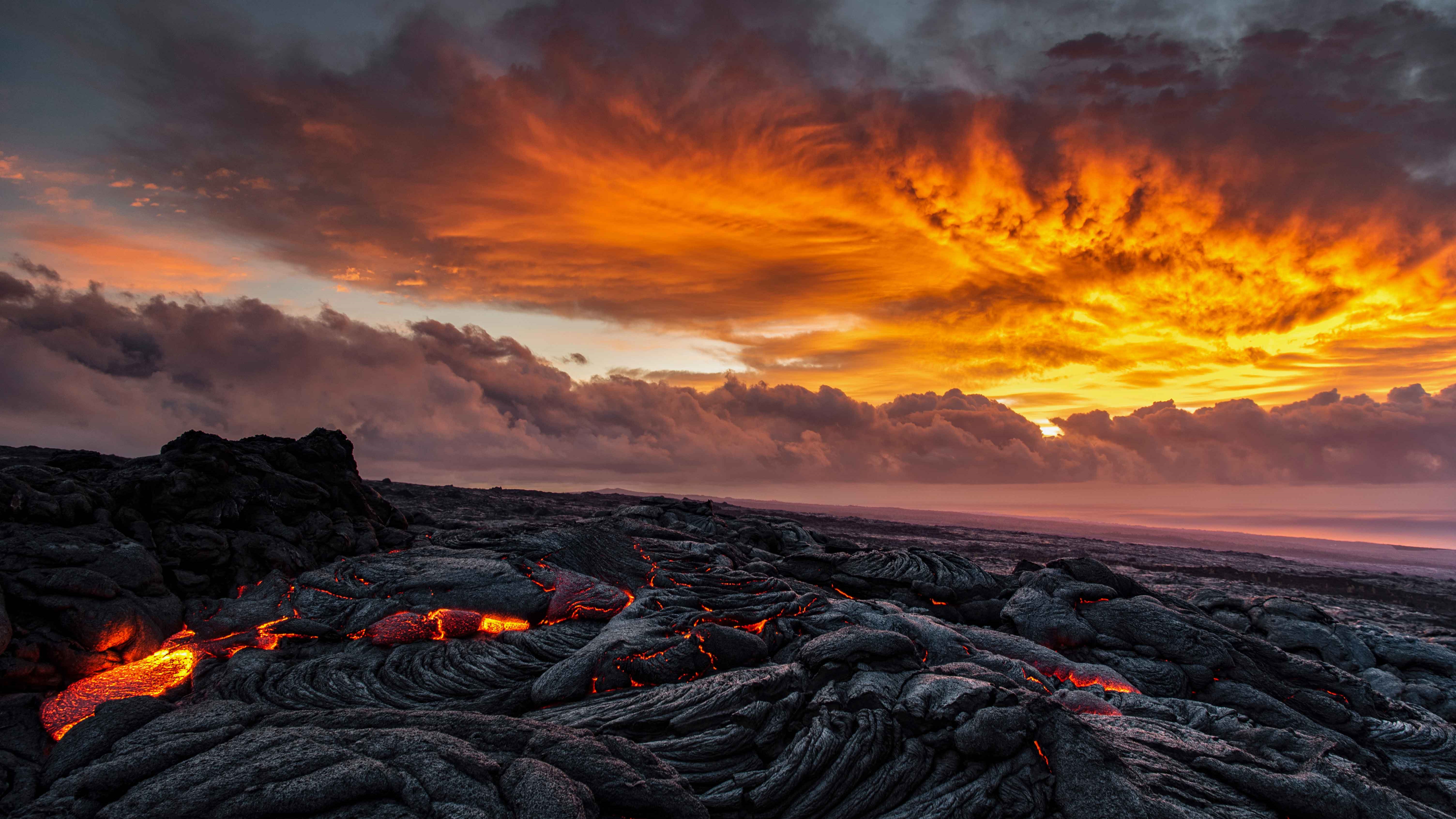 Lava flows under clouds