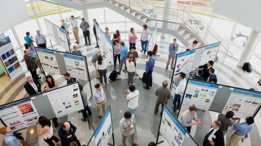 Argonne National Laboratory hosts a poster session where researchers present their work.