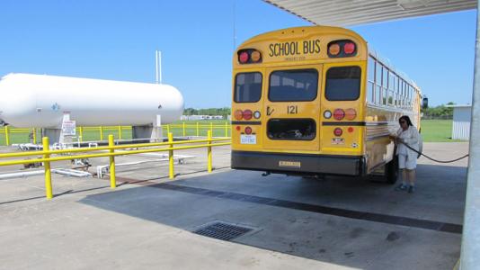 A school bus is fueled with propane in Alvin, Texas as part of an AFLEET case study. (Photo credit: Texas Railroad Commission)