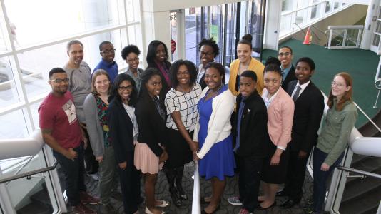 Argonne mentors stand beside students from Chicago-area schools. 