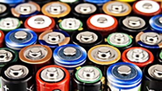 Various types of batteries standing upright