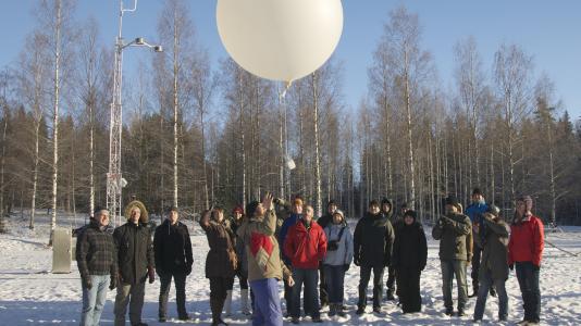 Members of the AMF2 launch team and scientists from the University of Helsinki and the Finnish Meteorological Institute launch a weather balloon at the kickoff meeting in Hyytiälä, Finland. The mobile facility will take climate data in Hyytiälä for eight months to study, among other things, how the boreal forest interacts with the atmosphere. 