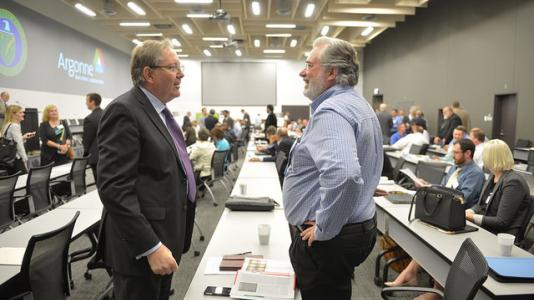 Argonne Laboratory Director Peter Littlewood (left) talks with a small business owner during the second annual "Doing Business with Argonne and Fermi National Laboratories" event.