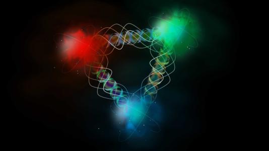 Argonne is working with other DOE national laboratories on the planned Electron Ion Collider, which will probe  how subatomic quarks (shown here in red, blue and green) interact through the exchange of gluons (shown as  wiggly helices). (Image courtesy of Shutterstock.)