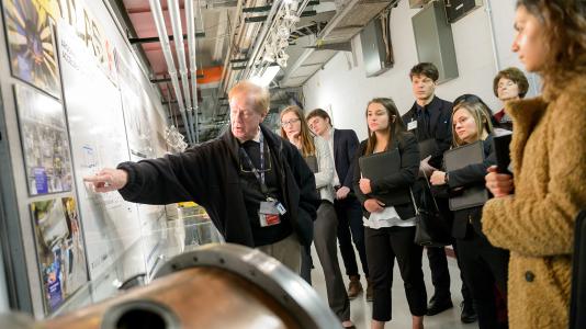 Students listen attentively as their guide explains the complex and groundbreaking research at the Argonne Tandem Linac Accelerator System (ATLAS). (Image by Argonne National Laboratory.)