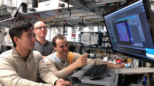 Scientists Kevin Miao, Chris Anderson and Alexandre Bourassa work on quantum research in the Awschalom lab at the University of Chicago’s Pritzker School of Molecular Engineering. (Image by David Awschalom.)