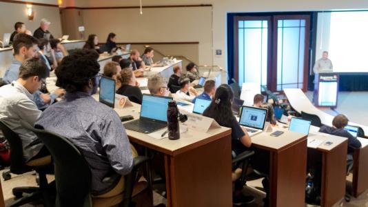 Attendees at ATPESC, an annual training program that provides specialized, in-depth training to doctoral students, postdocs and computational scientists on today’s most powerful supercomputers. (Image taken in 2019 by Argonne National Laboratory.)