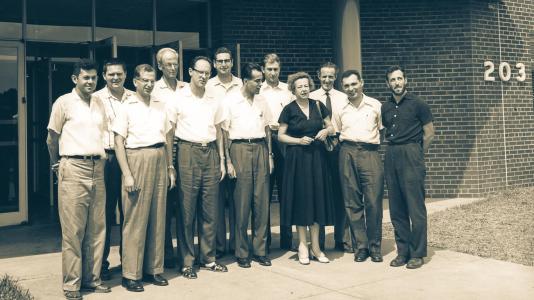 11 men and one woman in front of buidling. (Image by Argonne National Laboratory.)