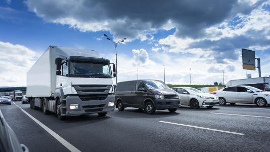 Photo of truck and cars. (Image by Shutterstock/MakDill.)