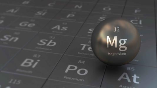 Ball-shaped Mg element on periodic table of the elements table background. (Image by Shutterstock/tunasalmon.)