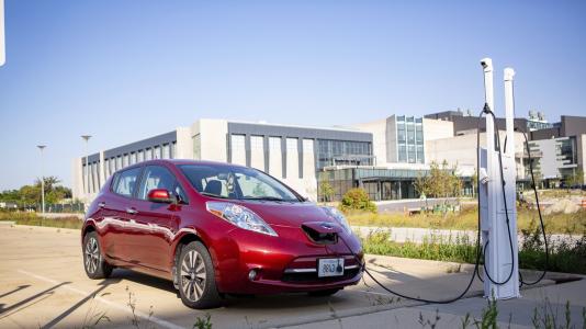 An electric vehicle charges on the Argonne campus.