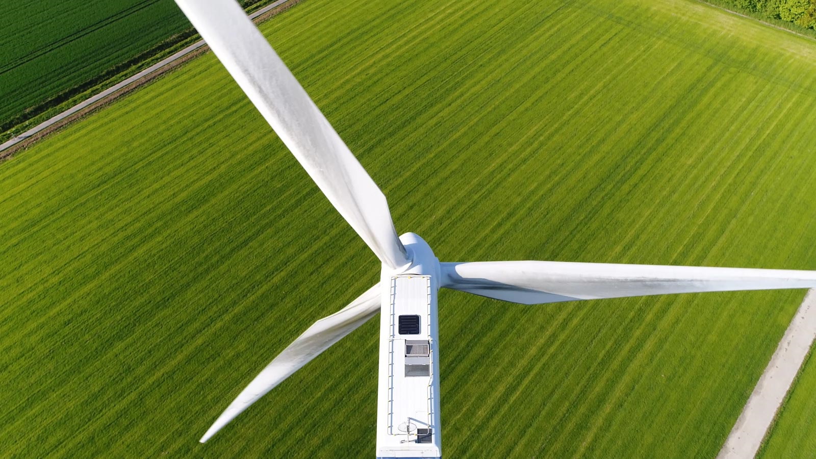 Wind turbine over green field